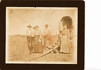  Family of Edward Doss and wife, Alabama Drake Doss. From left to right, Edward Doss (b. cir 1850), Alfred Doss (in background, son), Alabama Drake Doss (b. cir 1859), Muncell Doss (son), and Lucy Doss (daughter).  Alabama was the daughter of Catherine Wallace McFarlin. It is believed this photo may have been taken circa 1900 around Childress, TX.